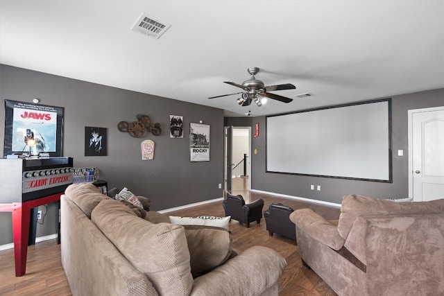 2205 Milan Dr, Cedar Park, TX 78613 - home theater room with wood finished floors, ceiling fan, and baseboards