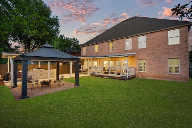 2205 Milan Dr, Cedar Park, TX 78613 - rear view of property with a gazebo, a patio area, brick siding, a deck, and an outdoor living space with a fire pit