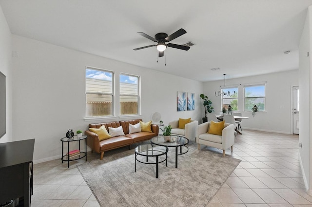 300 Wapiti Rd, Buda, TX 78610 - living room featuring light tile patterned floors, ceiling fan, and a chandelier