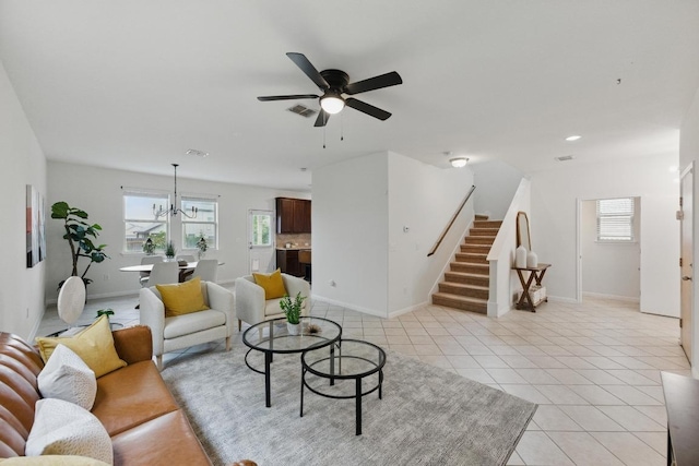 300 Wapiti Rd, Buda, TX 78610 - living area with stairs, ceiling fan, light tile patterned flooring, a chandelier, and recessed lighting