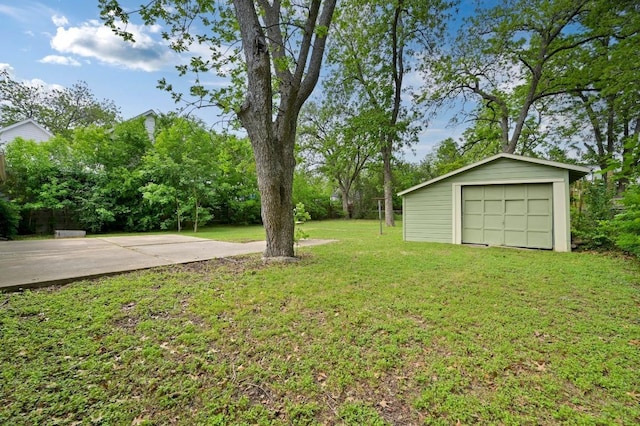 1002 Brentwood St, Austin, TX 78757 - view of grassy yard with an outbuilding and a garage