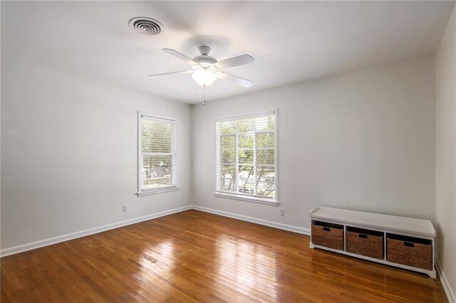 1002 Brentwood St, Austin, TX 78757 - unfurnished room featuring a ceiling fan, baseboards, and wood finished floors