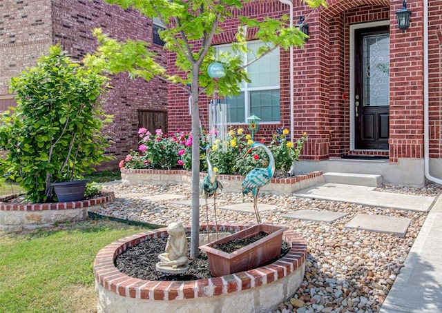 1117 Arbor Acres Loop, Leander, TX 78641 - view of exterior entry featuring brick siding