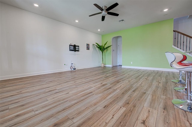 1117 Arbor Acres Loop, Leander, TX 78641 - spare room featuring ceiling fan, arched walkways, wood finished floors, baseboards, and recessed lighting
