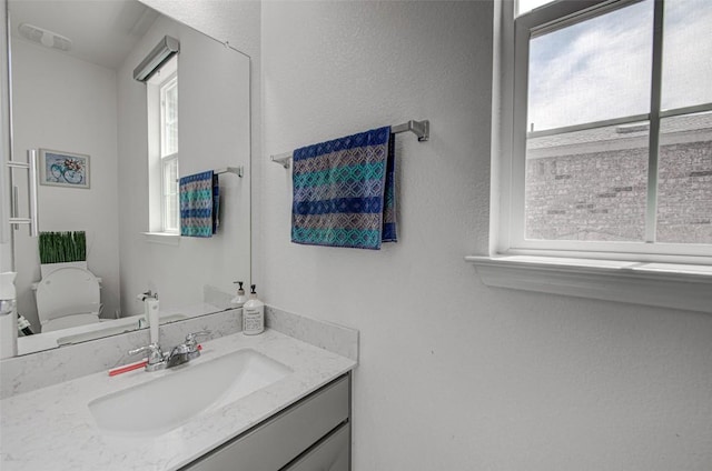 1117 Arbor Acres Loop, Leander, TX 78641 - bathroom with healthy amount of natural light, vanity, and toilet