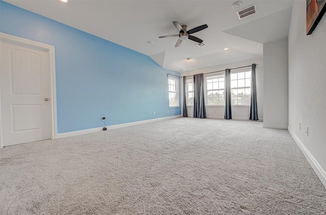 carpeted spare room featuring ceiling fan, baseboards, lofted ceiling, and recessed lighting