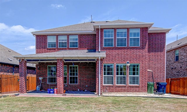 1117 Arbor Acres Loop, Leander, TX 78641 - back of house with a fenced backyard, brick siding, and a patio area