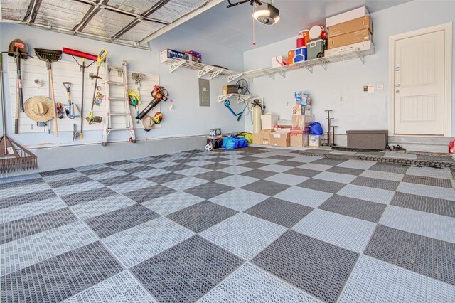 1117 Arbor Acres Loop, Leander, TX 78641 - garage with a garage door opener and electric panel