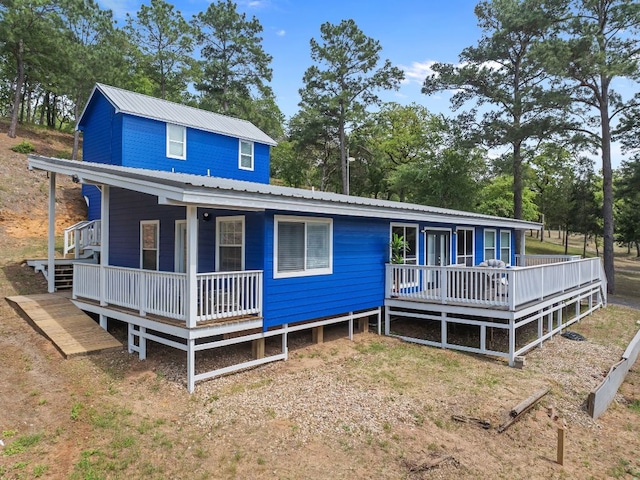 129 Valley Spur, Smithville, TX 78957 - farmhouse featuring covered porch and metal roof