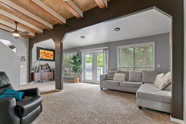 129 Valley Spur, Smithville, TX 78957 - carpeted living area with beamed ceiling, a ceiling fan, and french doors