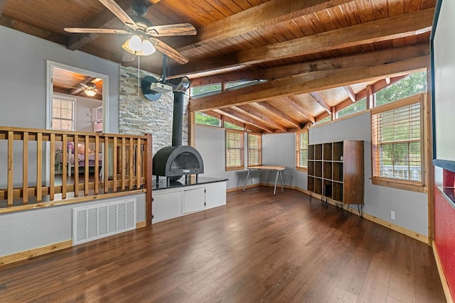 129 Valley Spur, Smithville, TX 78957 - unfurnished living room with wood ceiling, a wood stove, wood finished floors, and ceiling fan