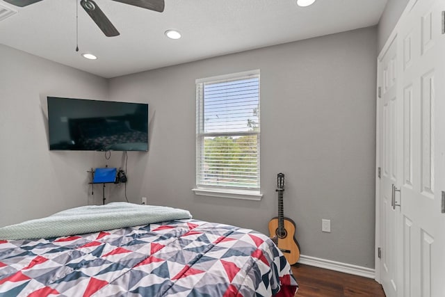 129 Valley Spur, Smithville, TX 78957 - bedroom with dark wood-style floors, a closet, recessed lighting, and a ceiling fan