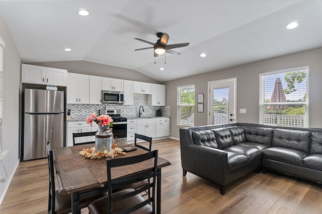 129 Valley Spur, Smithville, TX 78957 - living area with lofted ceiling, ceiling fan, light wood-type flooring, and recessed lighting
