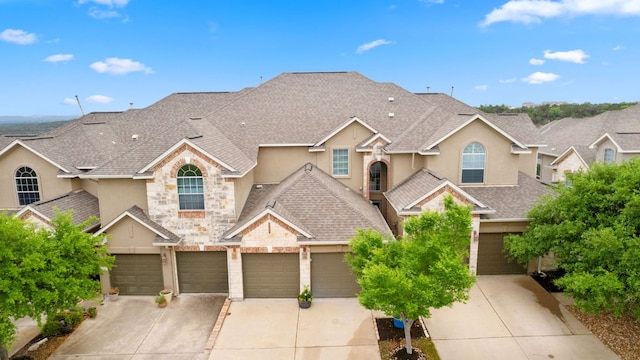 218 Sunrise Ridge Loop, Lakeway, TX 78738 - traditional home featuring stucco siding, driveway, stone siding, and a shingled roof