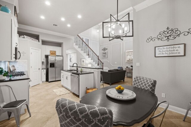 218 Sunrise Ridge Loop, Lakeway, TX 78738 - dining space with ornamental molding, recessed lighting, stairway, a high ceiling, and light tile patterned floors