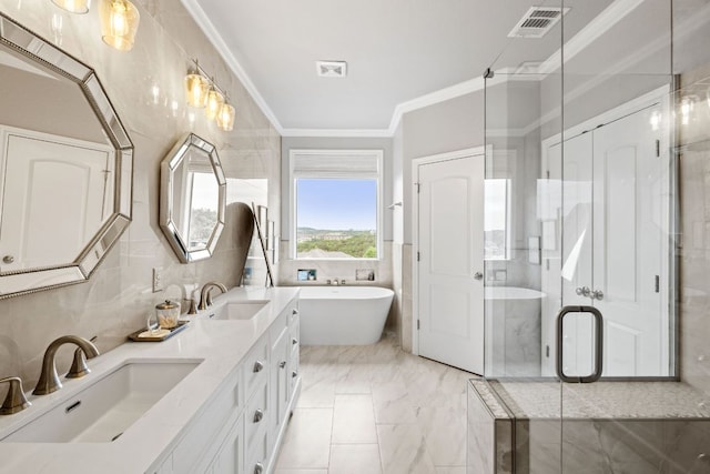 218 Sunrise Ridge Loop, Lakeway, TX 78738 - full bath featuring double vanity, a soaking tub, crown molding, a stall shower, and tile walls