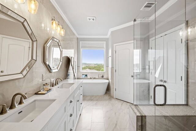 218 Sunrise Ridge Loop, Lakeway, TX 78738 - full bath with double vanity, a freestanding bath, crown molding, a stall shower, and tile walls