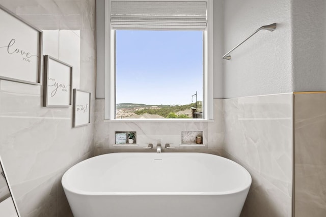218 Sunrise Ridge Loop, Lakeway, TX 78738 - full bathroom featuring a freestanding bath and tile walls