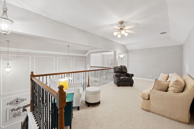 218 Sunrise Ridge Loop, Lakeway, TX 78738 - sitting room with ceiling fan, carpet, and an upstairs landing