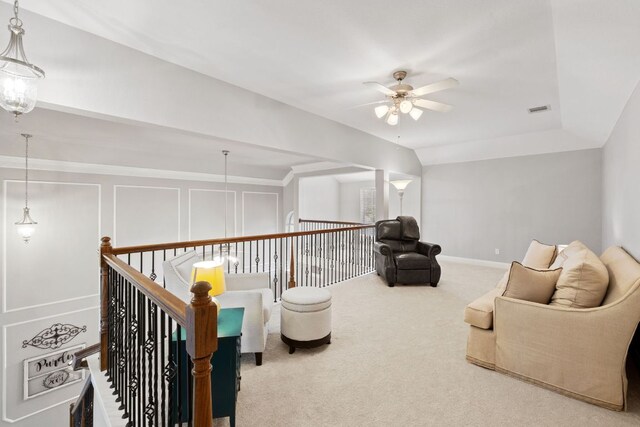218 Sunrise Ridge Loop, Lakeway, TX 78738 - sitting room with ceiling fan, carpet floors, and an upstairs landing