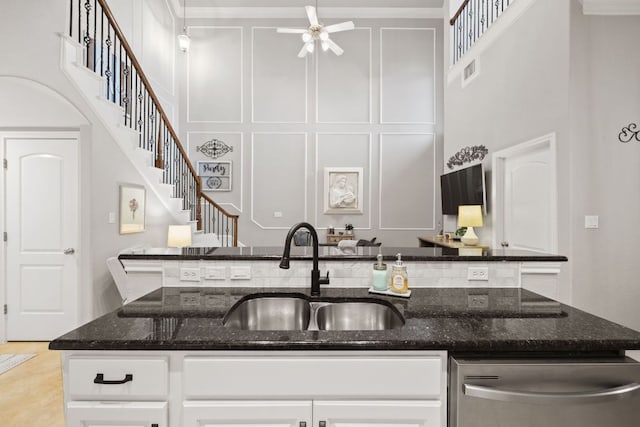 218 Sunrise Ridge Loop, Lakeway, TX 78738 - kitchen featuring dishwasher, a high ceiling, white cabinetry, dark stone counters, and ceiling fan