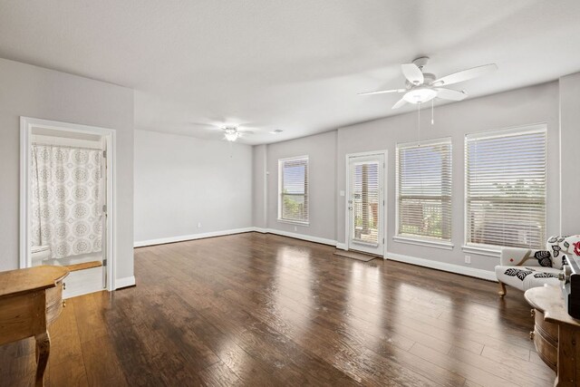 218 Sunrise Ridge Loop, Lakeway, TX 78738 - unfurnished living room featuring a ceiling fan and wood finished floors