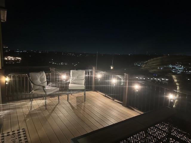 218 Sunrise Ridge Loop, Lakeway, TX 78738 - view of deck at twilight