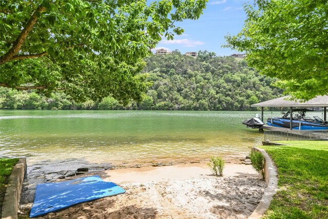 2305 Manana St, Austin, TX 78730 - view of yard with a dock, a water view, and a wooded view