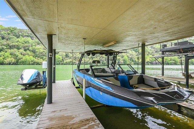2305 Manana St, Austin, TX 78730 - dock area featuring boat lift and a water view