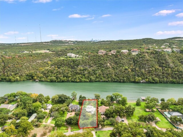2305 Manana St, Austin, TX 78730 - aerial view of property's location with property parcel outlined, a large body of water, and a forest