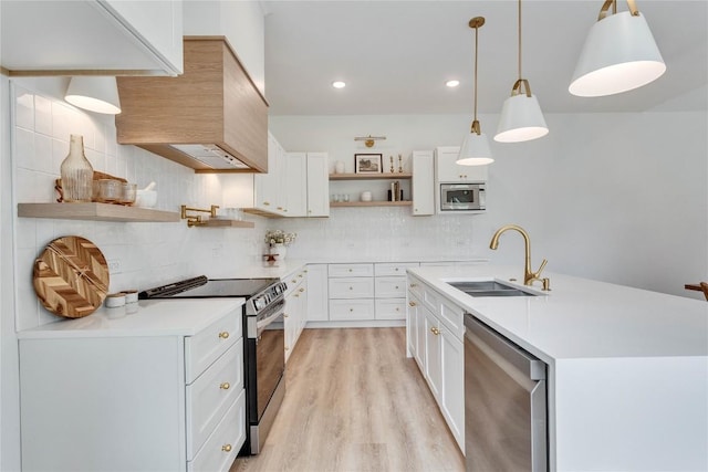 kitchen with open shelves, a sink, stainless steel appliances, light countertops, and backsplash