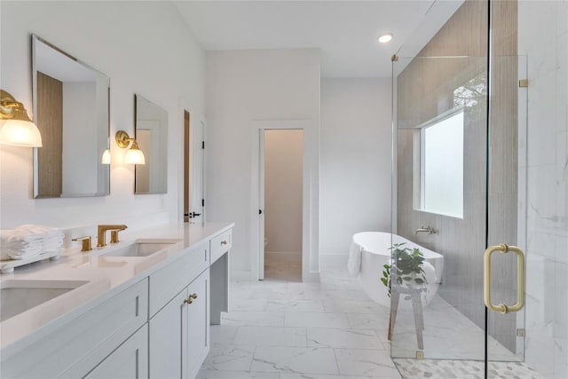 353 Nene Ln, Bastrop, TX 78602 - bathroom featuring double vanity, marble finish flooring, a soaking tub, a stall shower, and toilet