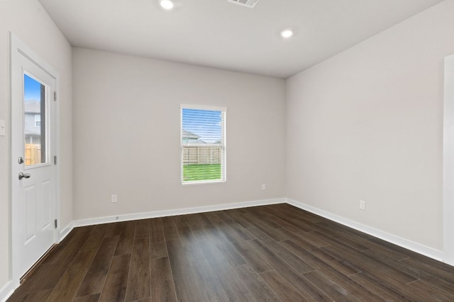 208 Lazy Lizzy Rd, Jarrell, TX 76537 - empty room featuring dark wood-style flooring and recessed lighting