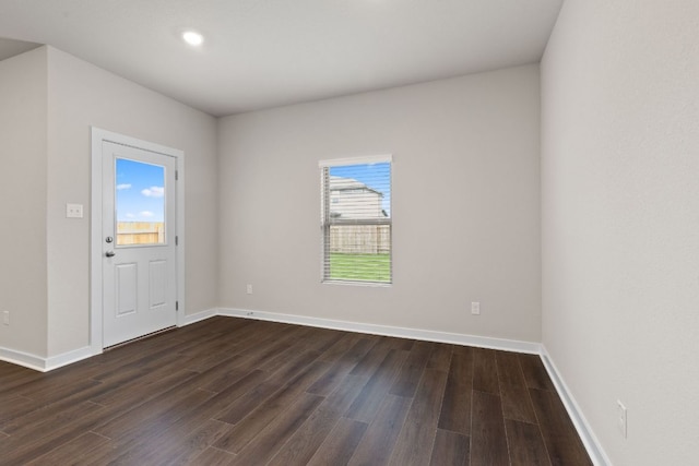 208 Lazy Lizzy Rd, Jarrell, TX 76537 - empty room with dark wood-style floors and recessed lighting