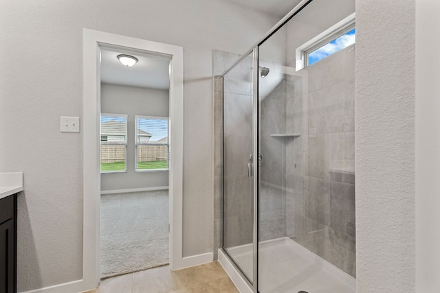 208 Lazy Lizzy Rd, Jarrell, TX 76537 - full bathroom with a stall shower, vanity, and a textured wall