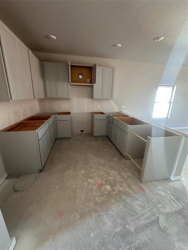 kitchen featuring concrete floors