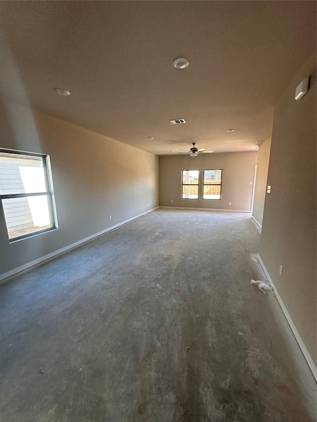spare room featuring baseboards, a ceiling fan, visible vents, and recessed lighting