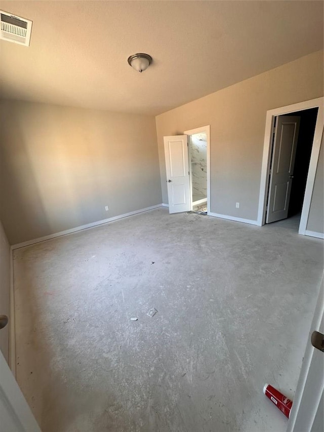 unfurnished bedroom with unfinished concrete floors, baseboards, and visible vents