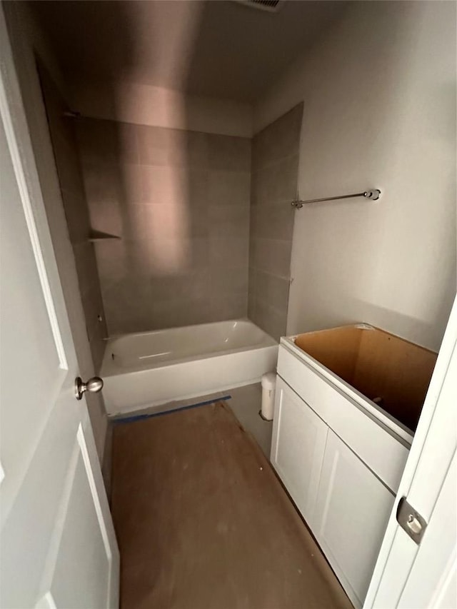 full bathroom with toilet, vanity, and shower / washtub combination