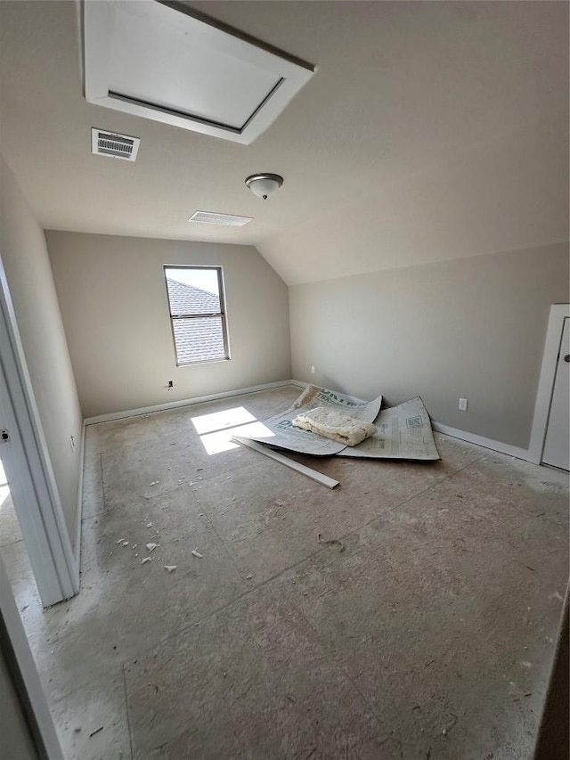 bonus room featuring lofted ceiling, visible vents, and baseboards