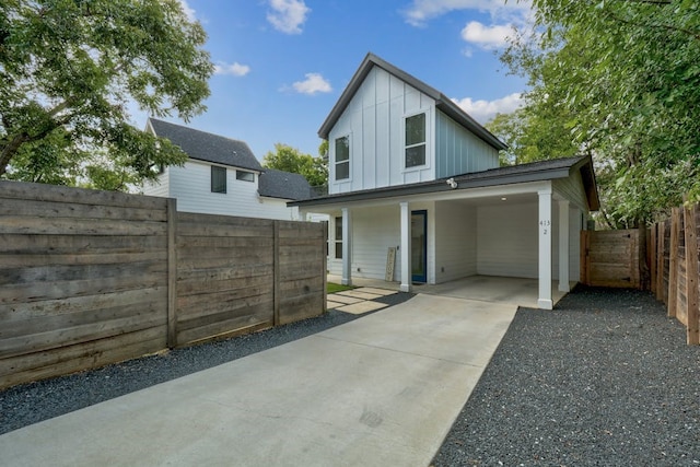413 W Odell St Unit 2, Austin, TX 78752 - view of front of property featuring board and batten siding and concrete driveway