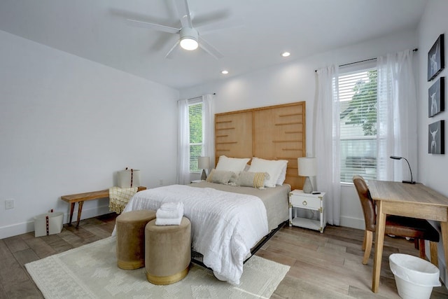 bedroom featuring recessed lighting, light wood-style flooring, and a ceiling fan