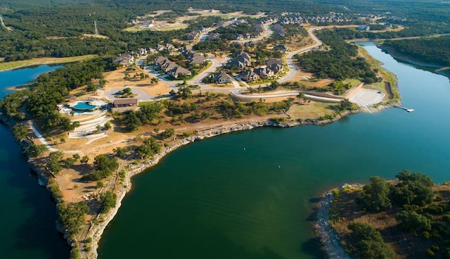 bird's eye view with a view of trees and a water view