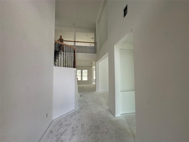 22120 Cross Timber Bnd, Lago Vista, TX 78645 - corridor featuring unfinished concrete floors and a high ceiling