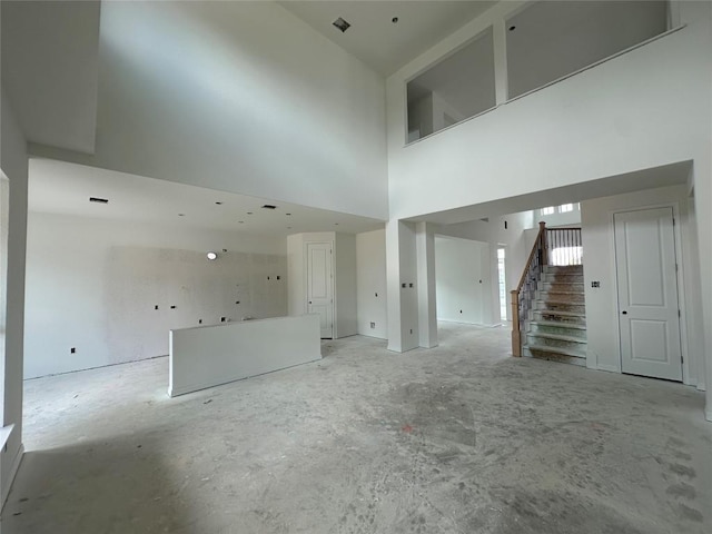 22120 Cross Timber Bnd, Lago Vista, TX 78645 - unfurnished living room with stairway and a high ceiling