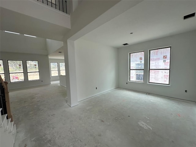 22120 Cross Timber Bnd, Lago Vista, TX 78645 - spare room with unfinished concrete floors and stairway