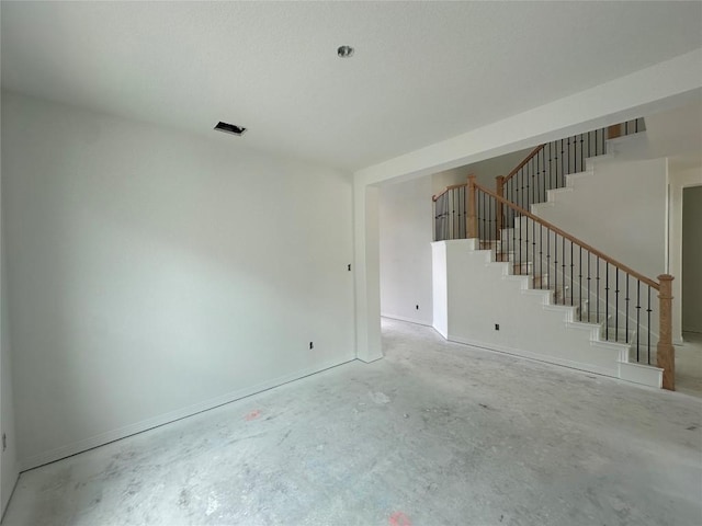 22120 Cross Timber Bnd, Lago Vista, TX 78645 - unfurnished living room with concrete floors and stairway