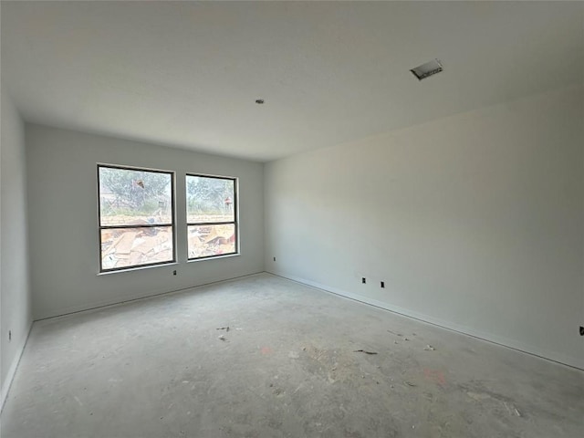 22120 Cross Timber Bnd, Lago Vista, TX 78645 - spare room featuring concrete floors and baseboards