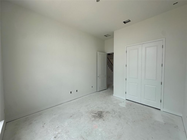 22120 Cross Timber Bnd, Lago Vista, TX 78645 - unfurnished bedroom with concrete floors and a closet