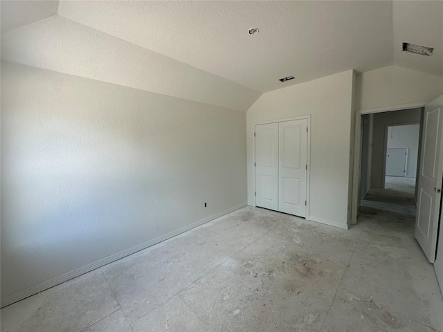 22120 Cross Timber Bnd, Lago Vista, TX 78645 - unfurnished bedroom featuring vaulted ceiling and a closet